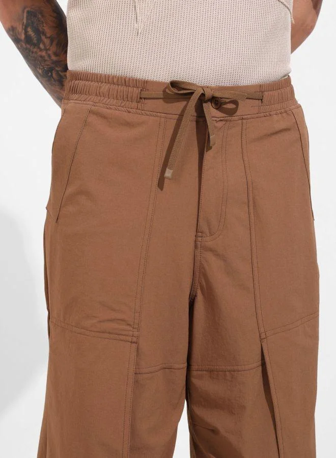 The Indian Garage Co  Men Baggy Fit Solid Cross Pocket Mid-Rise Trousers for Men | Best Price UAE